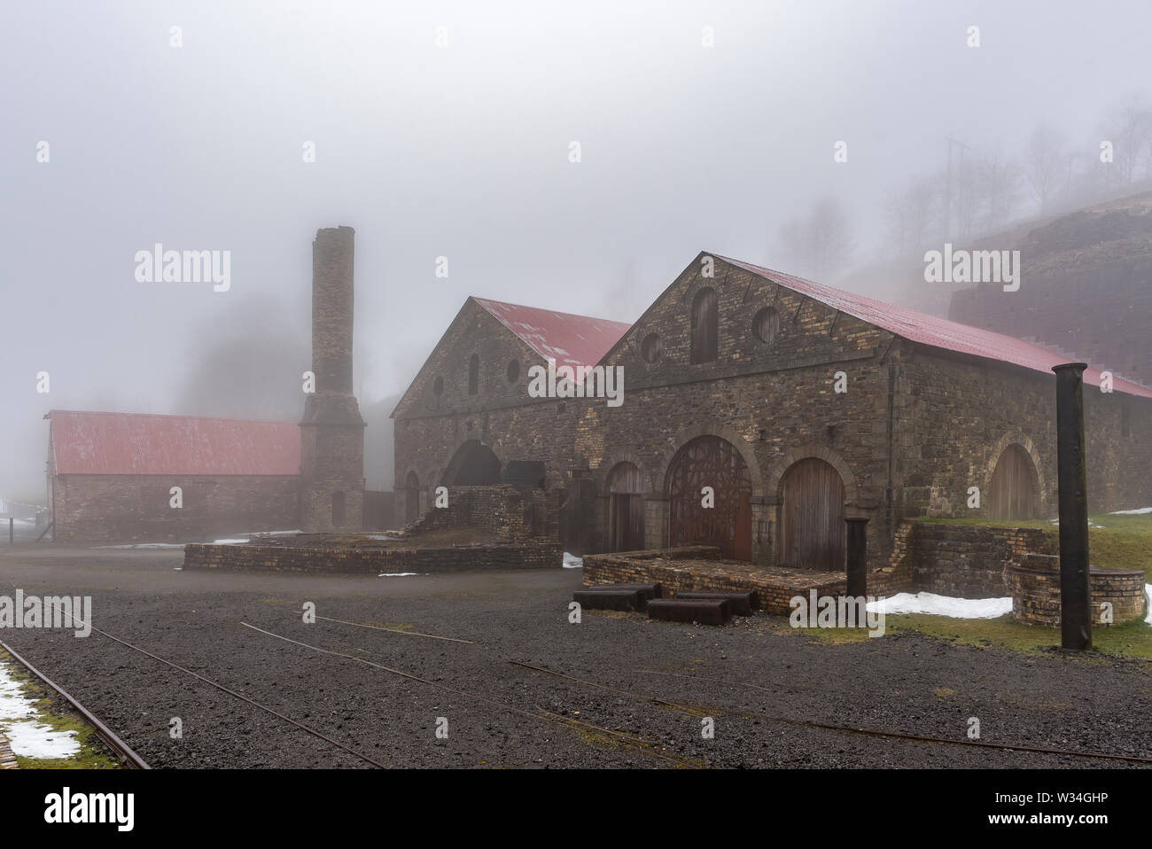 Blaenavon Ironworks, in the South Wales Valleys, with the old, industrial buildings cloaked in fog and mist Stock Photo