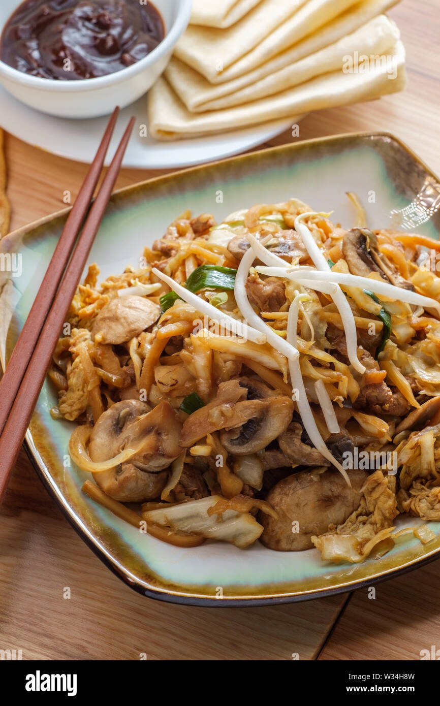 Chinese food Moo shu pork with Mandarin pancake wrappers and hoisin