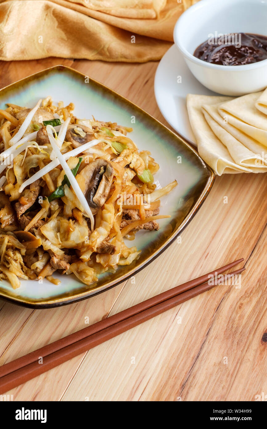 Chinese food Moo shu pork with Mandarin pancake wrappers and hoisin