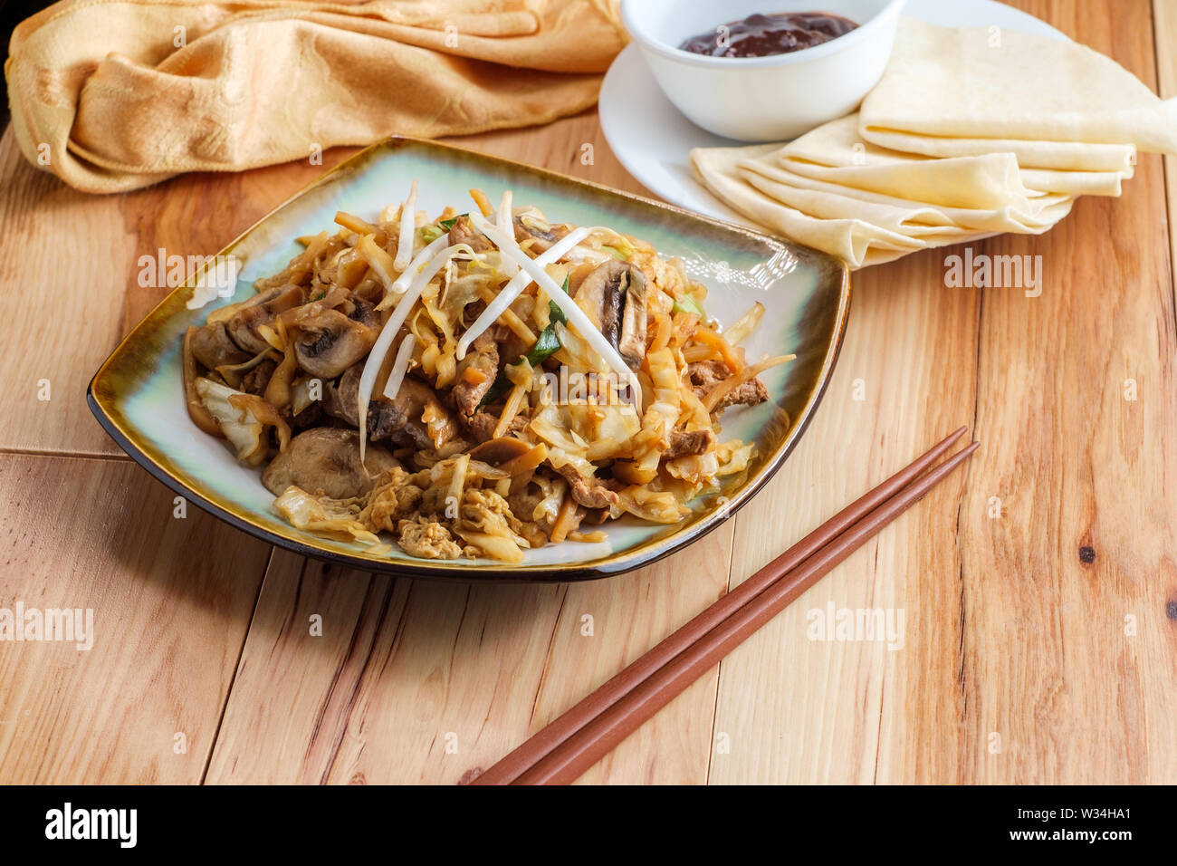 Chinese food Moo shu pork with Mandarin pancake wrappers and hoisin