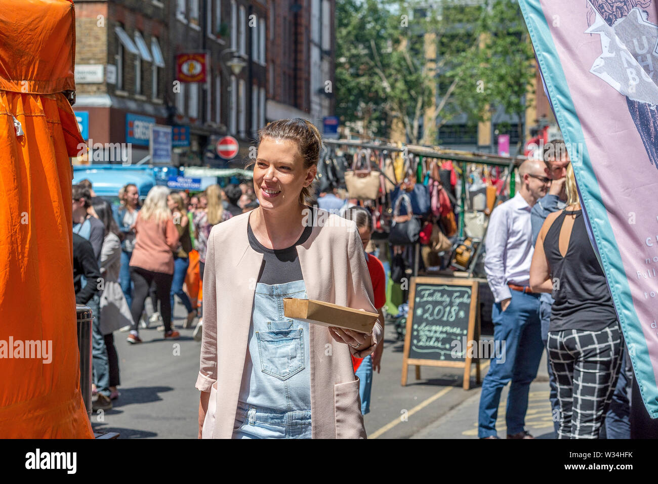 The open air and colourful street market at Leather Lane during a busy lunch hour Stock Photo