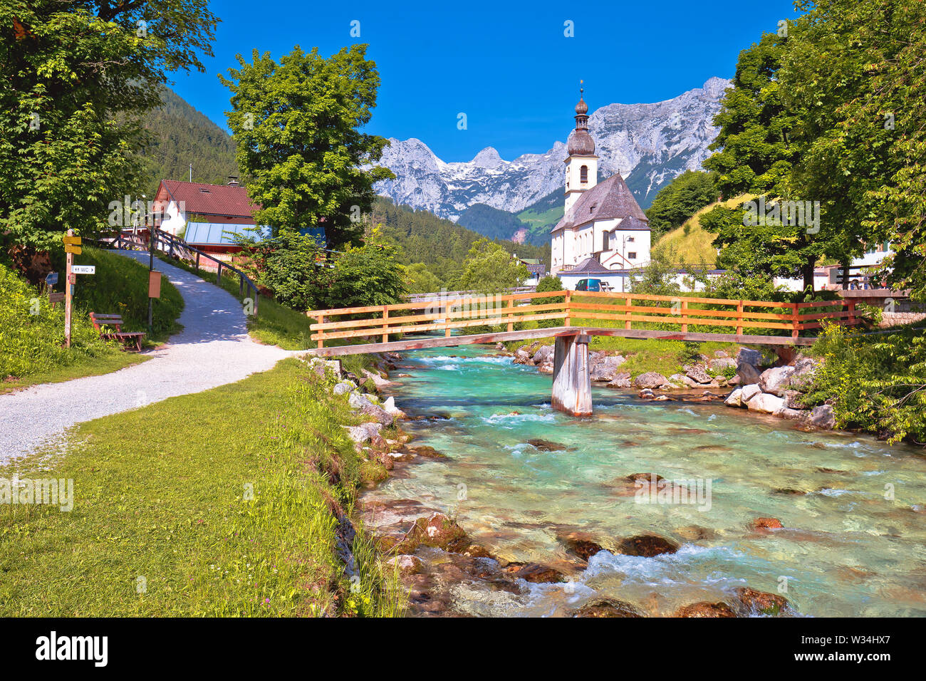 Sankt Sebastian pilgrimage church with alpine turquoise river alpine landscape view, Ramsau, Nationalpark Berchtesgadener Land, Bavaria, Germany Stock Photo