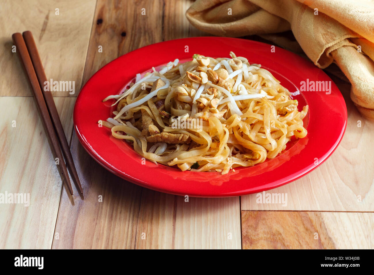 Authentic cuisine pad thai with chickem rice noodles smoked tofu bean sprouts and peanuts Stock
