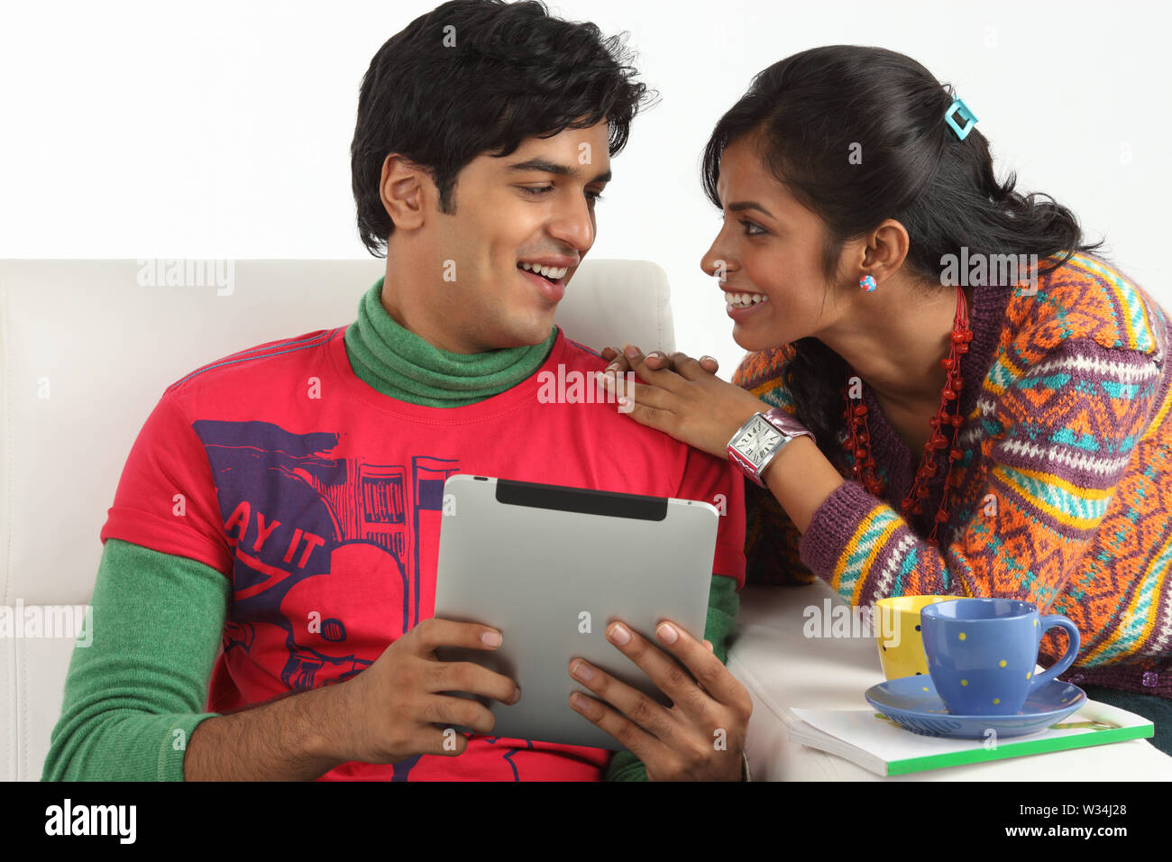 Indian couple looking at each other and smiling Stock Photo - Alamy