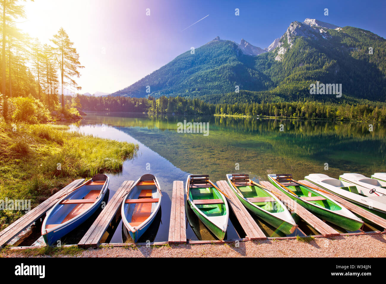 Colorful boats on Hintersee lake in Berchtesgaden Alpine landscape sunrise view, Bavaria region of Germany Stock Photo