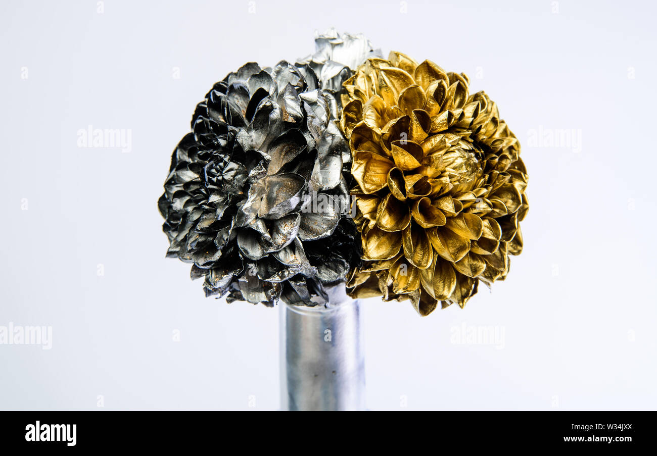 fantasy flower. silver and gold chrysanthemum flower in bottle. luxury and success. metallized antique decor. isolated on white. wealth richness. floristics business. Vintage retro. grunge beauty. Stock Photo