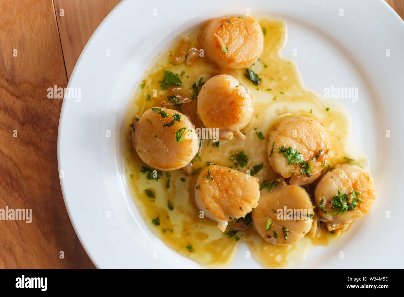 Seared scallops and herbs hires stock photography and images Alamy