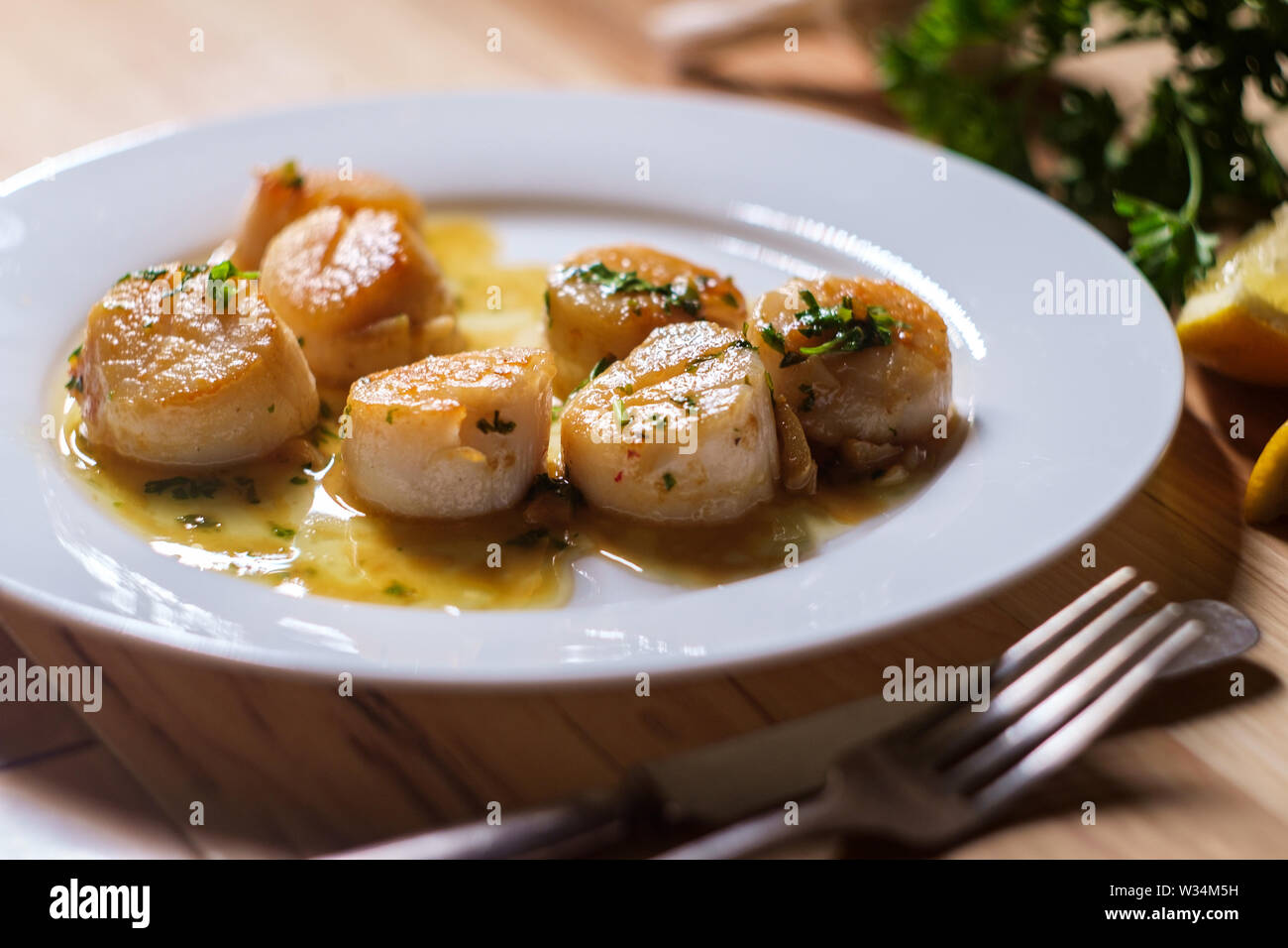 Seared Portuguese scallops in a white white wine lemon garlic sauce
