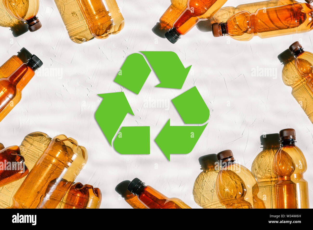 Plastic bottles and reuse mark. Recycling of plastic. Environmental Protection. Green recycle symbol. Environmental problems Stock Photo
