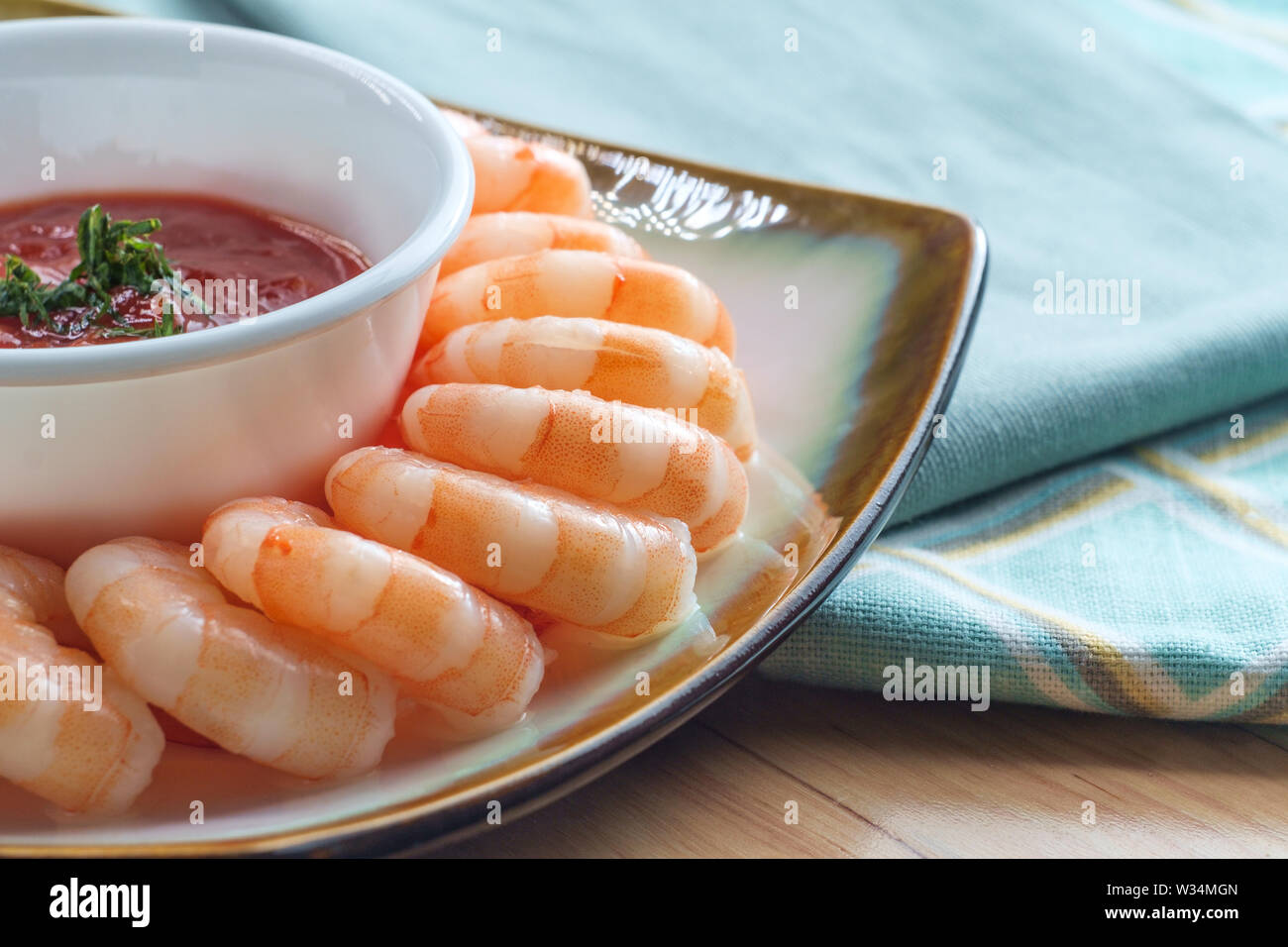 Delightful tailon shrimp cocktail served with horseradish dipping