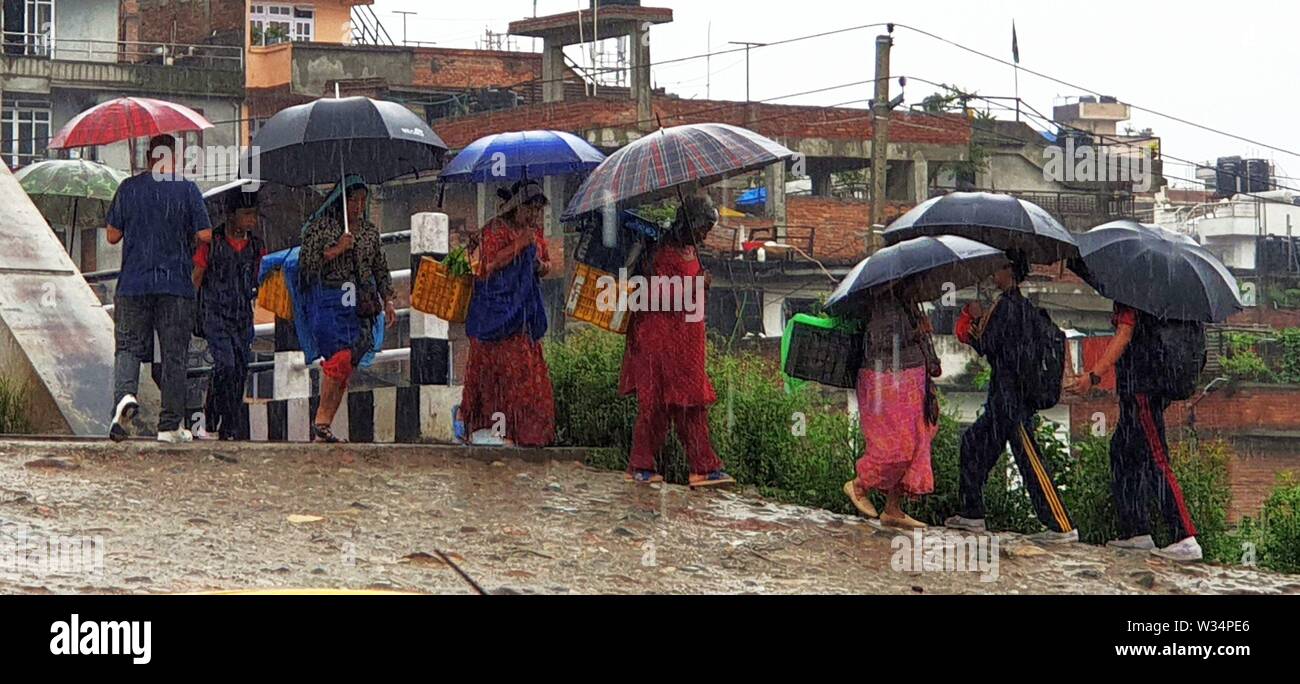 Kathmandu Nepal 12th July 2019 People Walk In The Rain In