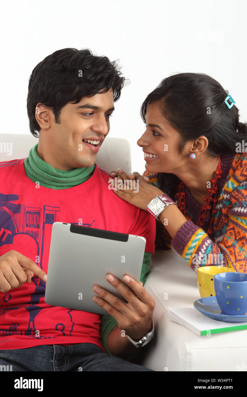 Indian couple looking at each other and smiling Stock Photo - Alamy
