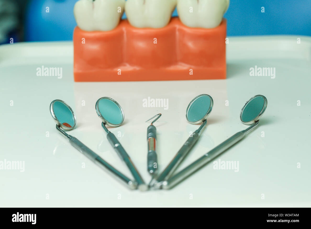 Or Instruments With Teeth White teeth and dental instruments Stock Photo - Alamy