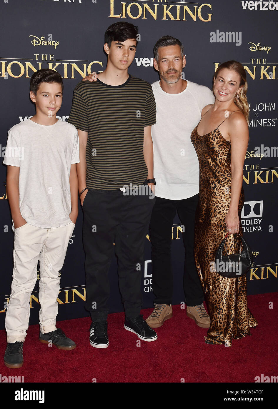 HOLLYWOOD, CA - JULY 09: Eddie Cibrian (2nd from R), LeAnn Rimes (R) and children attend the premiere of Disney's 'The Lion King' at the Dolby Theatre Stock Photo
