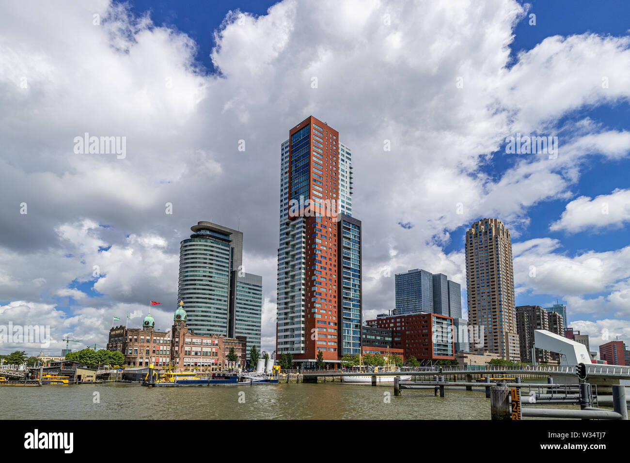 Skyline of Kop van Zuid district in Rotterdam, Netherlands, with Hotel New York and skyscapers World Port Center, Montevideo tower and New Orleans tow Stock Photo