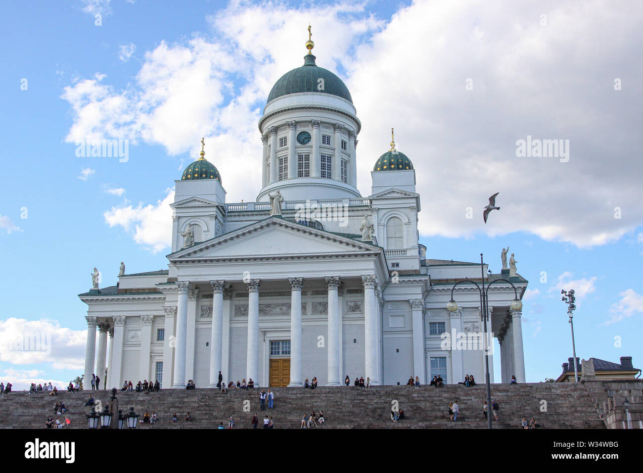 View from Helsinki Senate Square up the stairs to Helsinki Cathedral | Helsinki Cathedral is a distinctive landmark, with its tall, green dome surroun Stock Photo