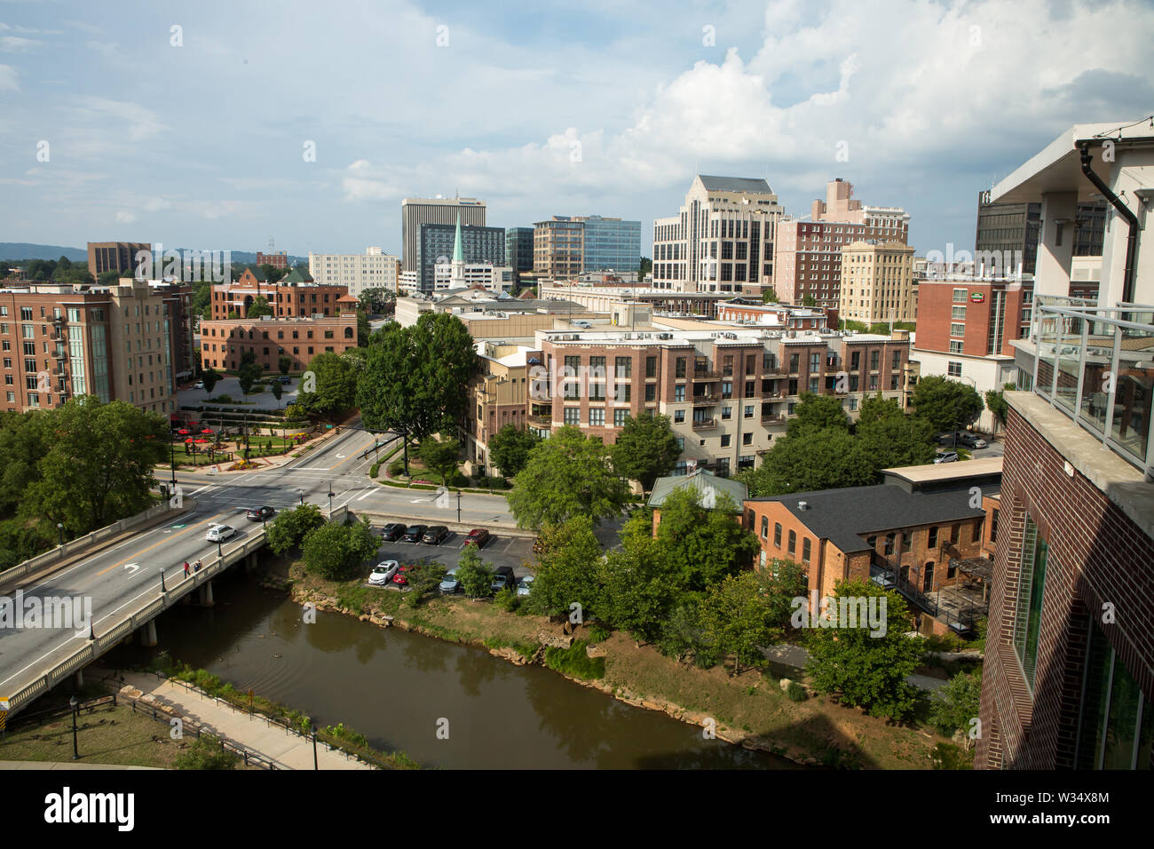 GREENVILLE, SC (USA) - July 5, 2019: A rooftop view of the Greenville skyline with the Reedy River at bottom. Stock Photo
