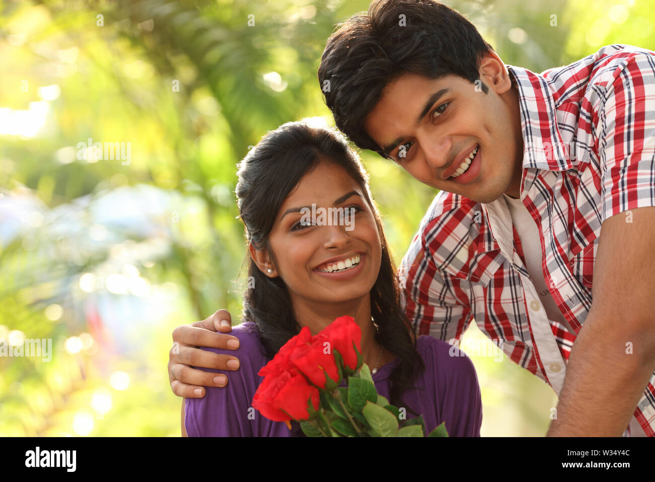 Portrait of an Indian young couple smiling Stock Photo - Alamy