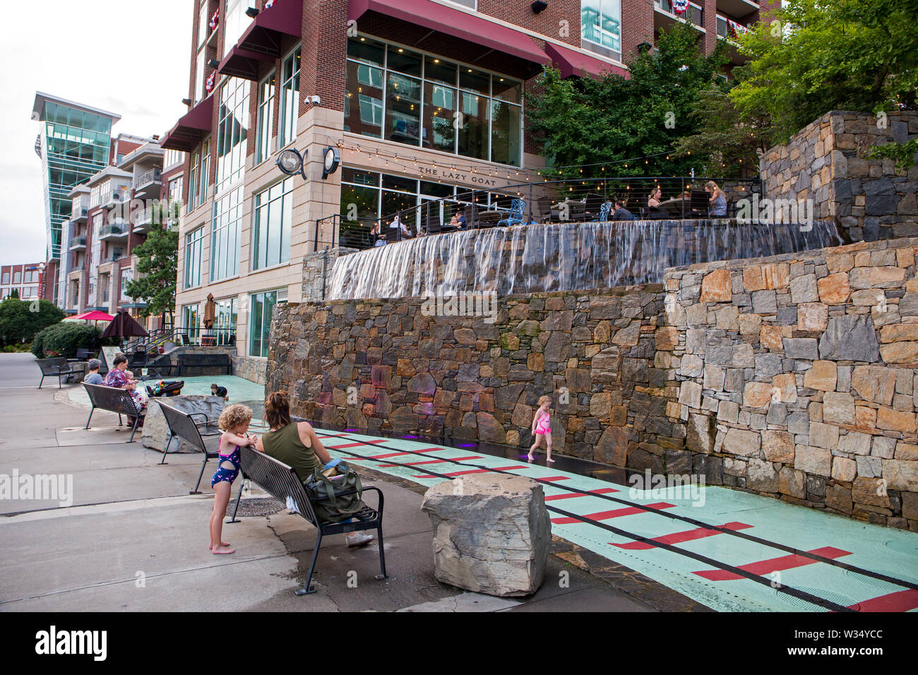 GREENVILLE, SC (USA) - July 5, 2019: A view of the downtown River Walk with the River Place development of hotels, restaurants and shops. Stock Photo