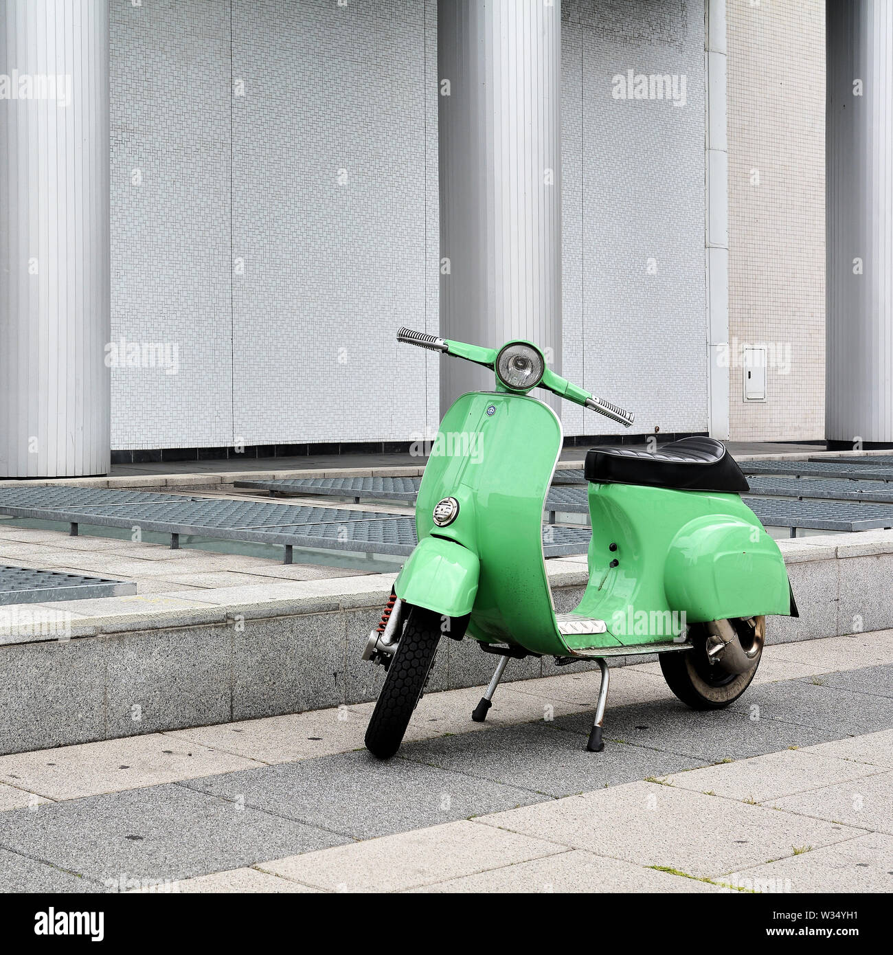 a green Vespa on the roadside in Berlin Stock Photo - Alamy