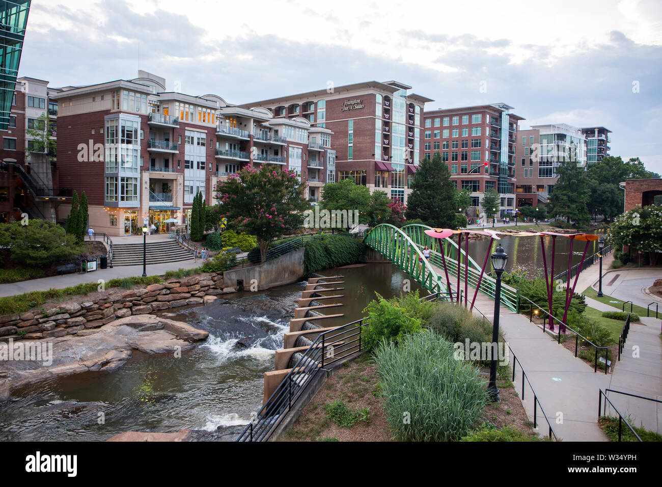 GREENVILLE, SC (USA) - July 5, 2019:  A view of the downtown River Walk with the River Place development of hotels, restaurants and shops. Stock Photo
