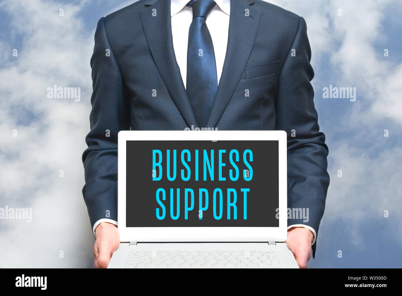 Business support advisor offers online help to businesss. Consultant worker in business suit Stock Photo