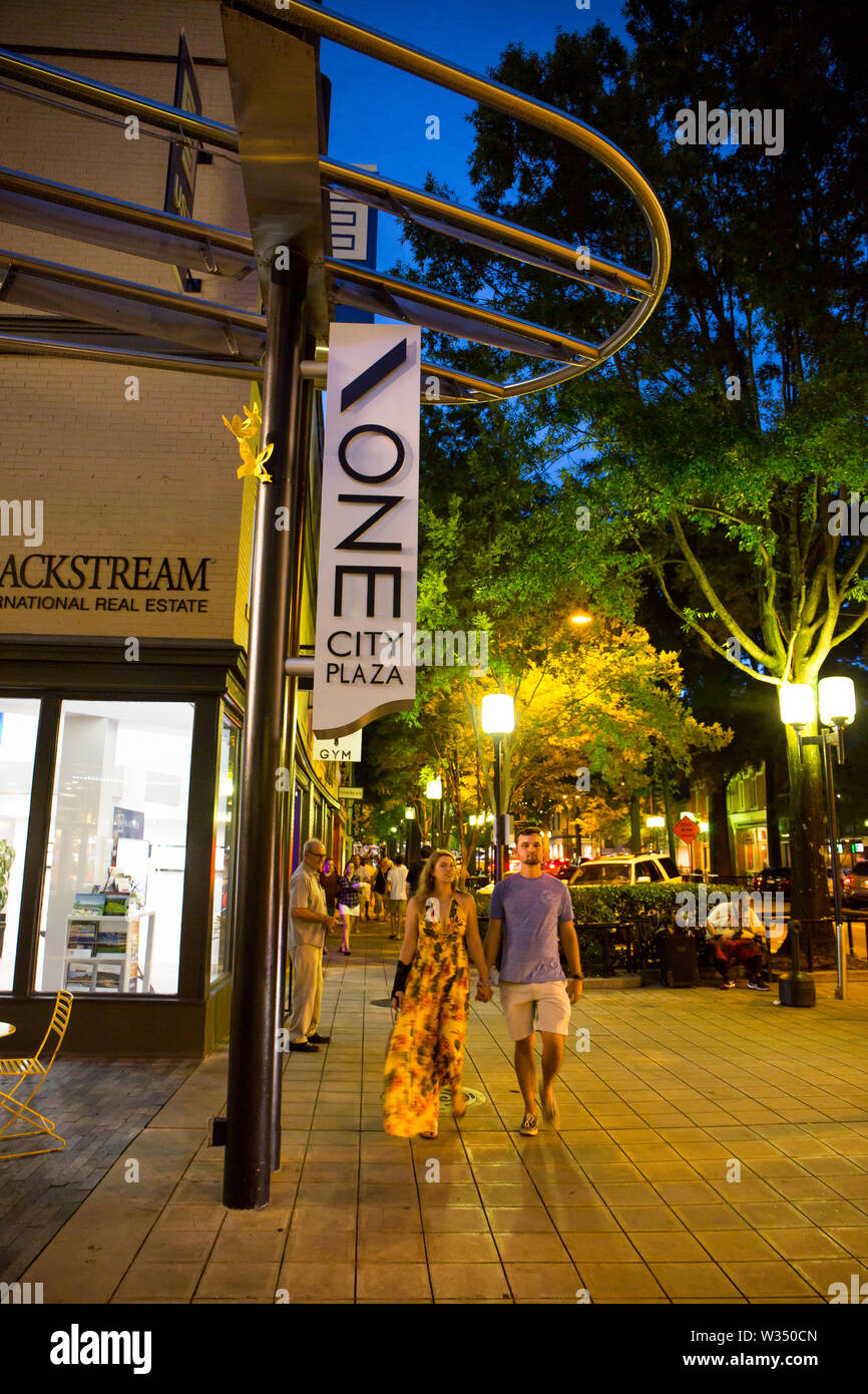 GREENVILLE, SC (USA) - July 5, 2019:  People enjoying a warm summer night among the shops and restaurants of downtown Greenville. Stock Photo