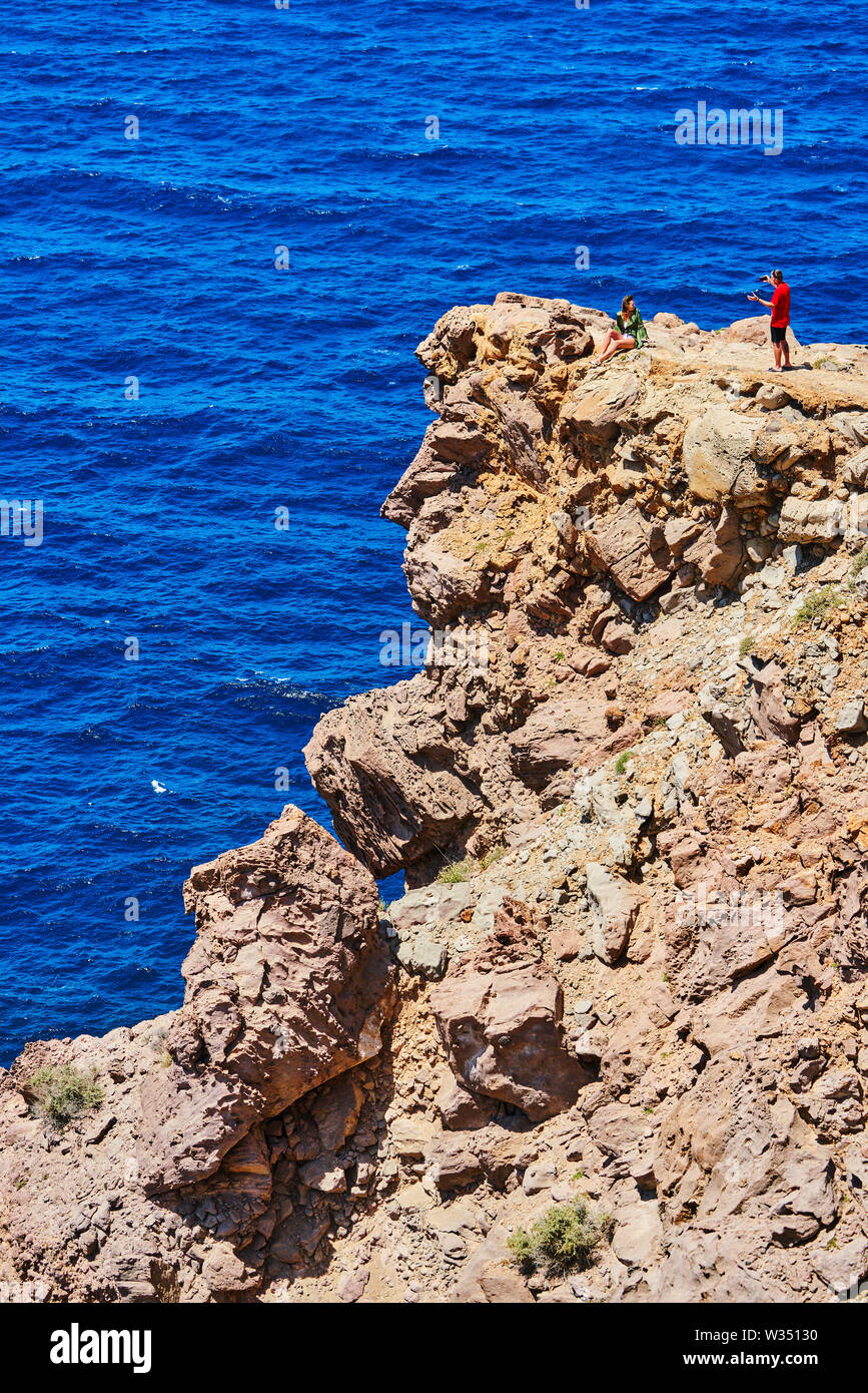 Tourists make dangerous selfies at their visit of the lighthouse in