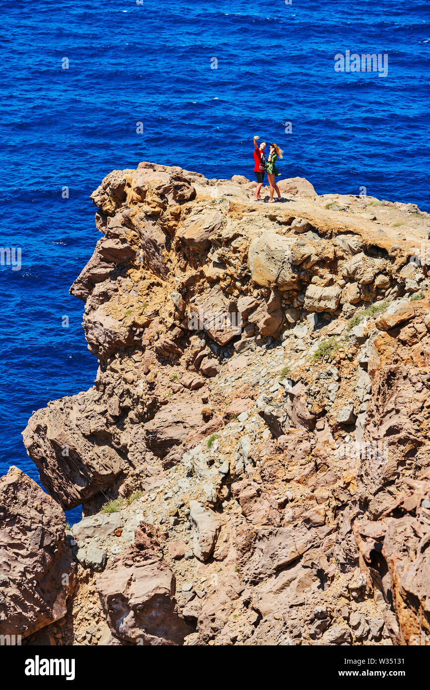 Tourists make dangerous selfies at their visit of the lighthouse in