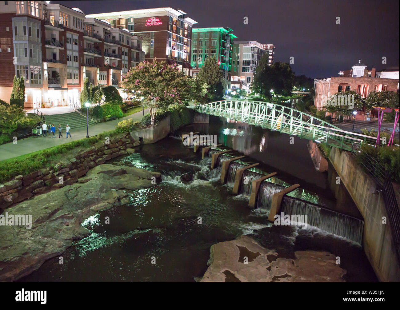 GREENVILLE, SC (USA) - July 5, 2019: A night-time view of the downtown  River Walk with the River Place development of hotels, restaurants and  shops Stock Photo - Alamy