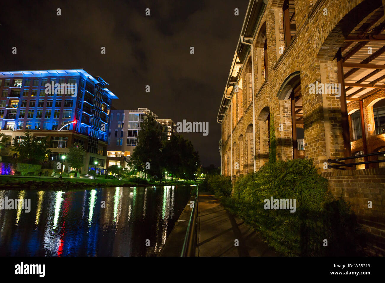 GREENVILLE, SC (USA) - July 5, 2019:  A view of the River Walk and River Place development of shops, restaurants and hotels with the Wyche Pavilion at Stock Photo