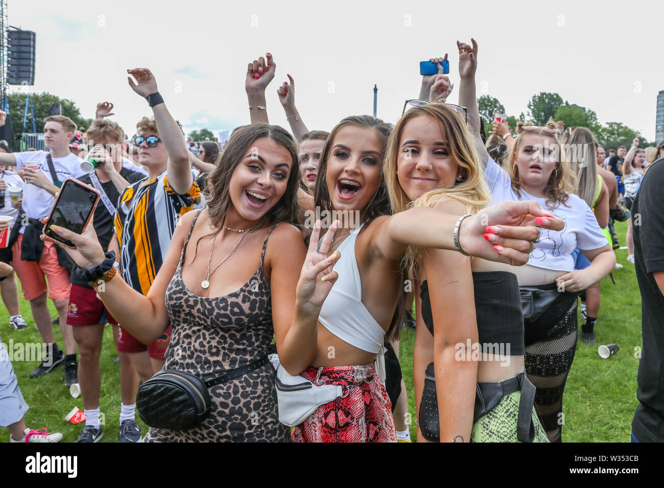 12 July 2019 Glasgow.  Glasgow's biggest music festival 'TRNSMT' continues in Glasgow Green public park with thousands of spectators enjoying the various music bands and dancing in the summer sunshine. The festival continues for three days and concludes late on Sunday 14th July Stock Photo
