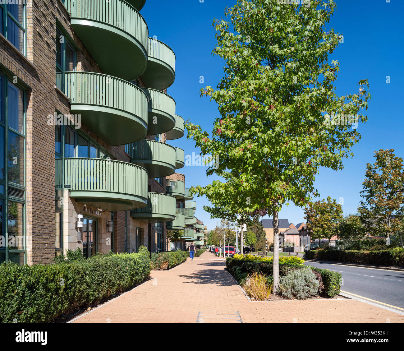 Contextual view with street. Kidbrooke Village Phase 5, Kidbrooke, United Kingdom. Architect