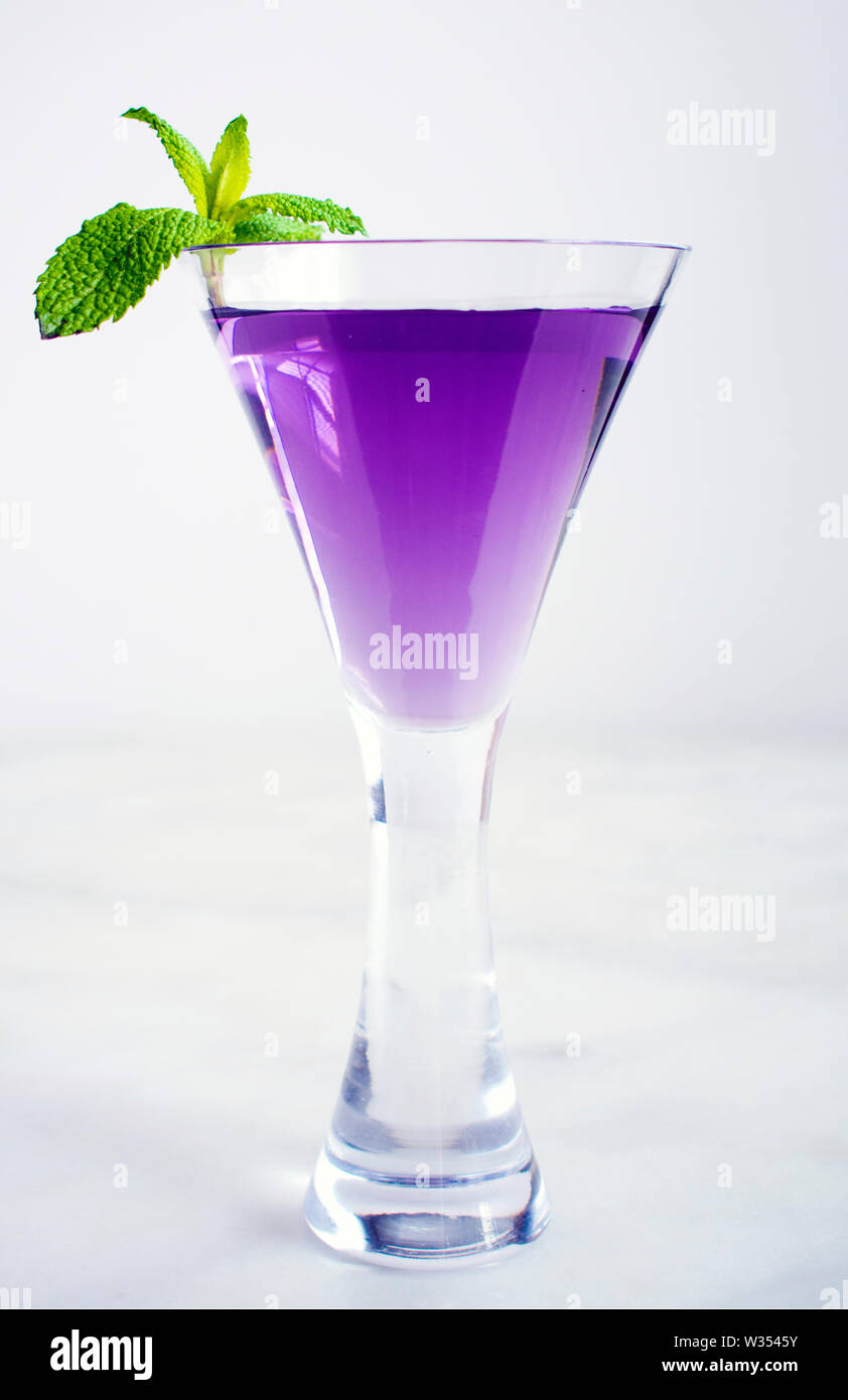 Purple Cocktail with Mint Garnish Stock Photo Alamy
