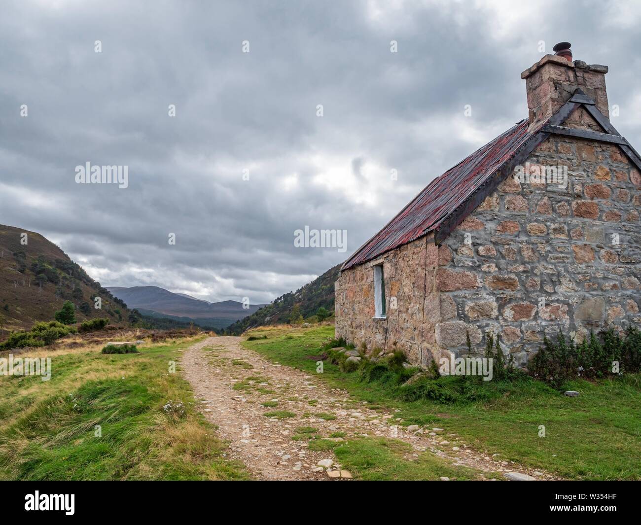 A mountain bothy in the highlands of Scotland on a cloudy, stormy day Stock Photo