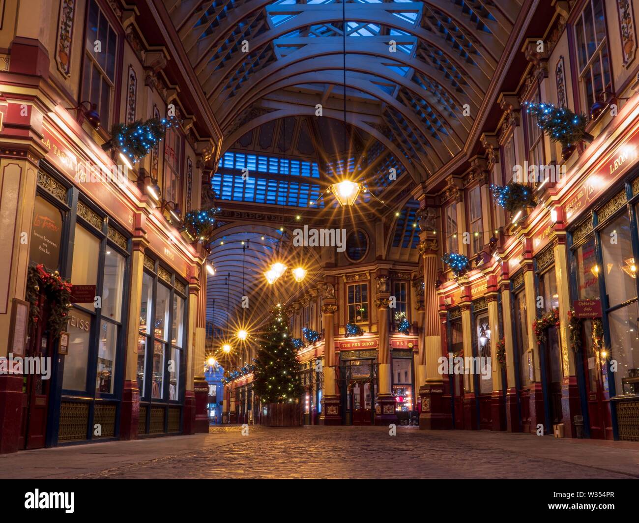 A view of the Christmas tree on a quiet night in Leadenhall Market in London Stock Photo