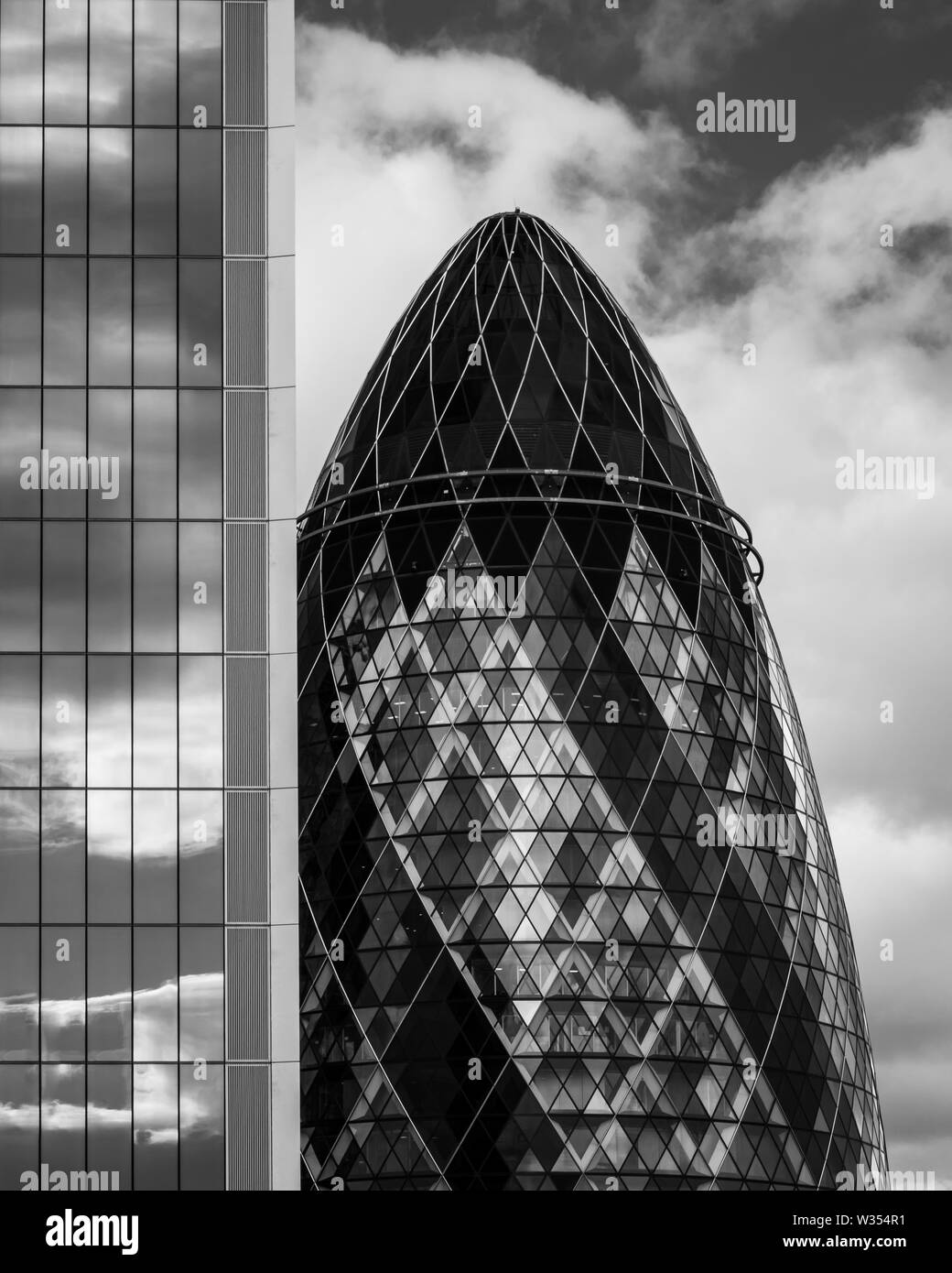 A black and white image of the top of the Gherkin building in London Stock Photo