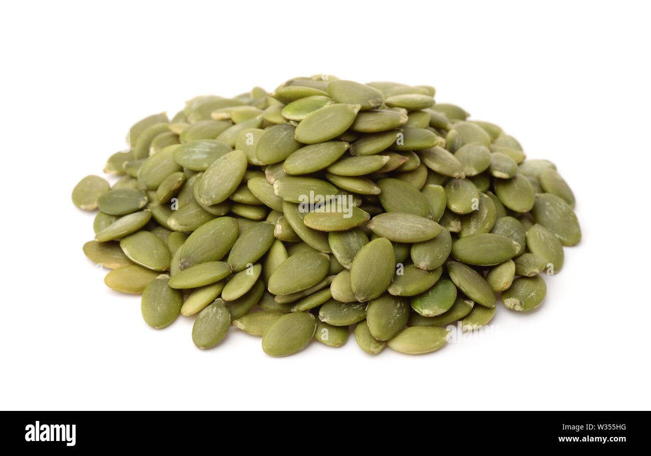 Heap of fresh shelled pumpkin seeds isolated on white Stock Photo
