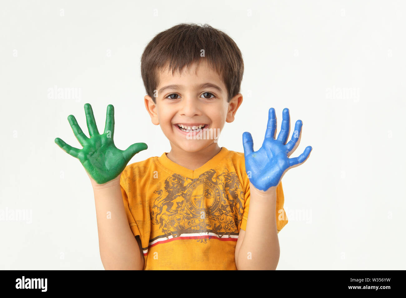 Indian Child Color Hand Portrait of an Indian boy with painted hands Stock Photo - Alamy