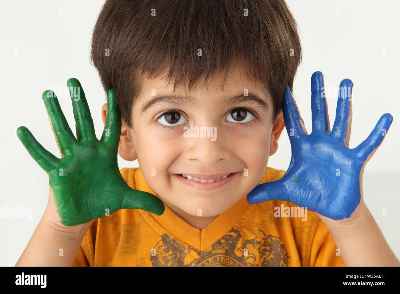 Indian Child Color Hand Portrait of an Indian boy showing his painted hands Stock Photo - Alamy