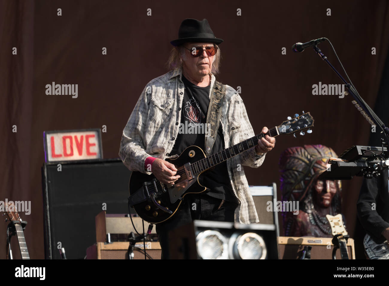 London, UK. Friday, 12 July, 2019. Neil Young performing on stage in ...