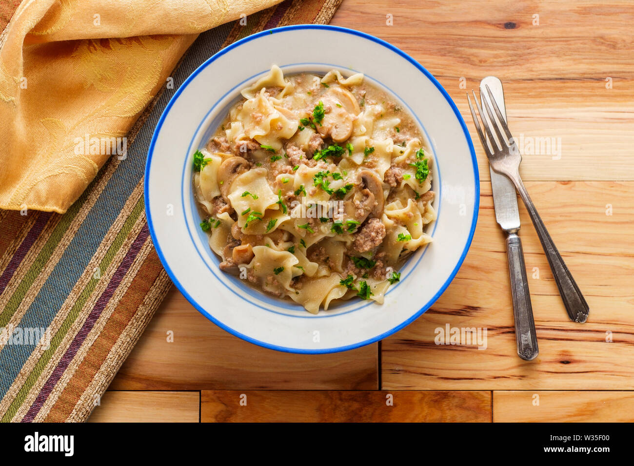 Creamy beef and mushroom stroganoff with egg noodles Stock Photo - Alamy