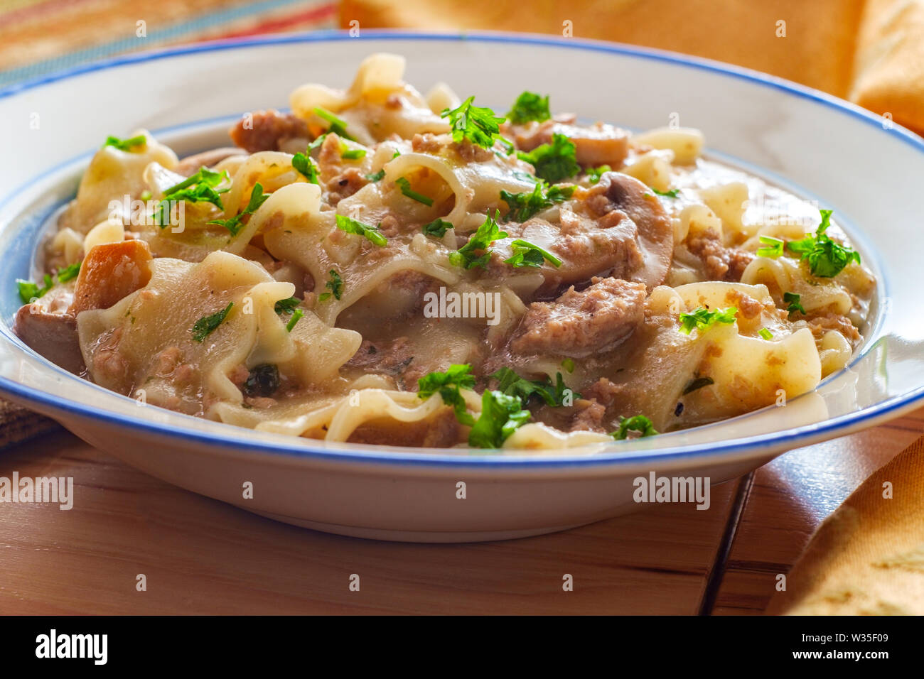 Creamy beef and mushroom stroganoff with egg noodles Stock Photo - Alamy