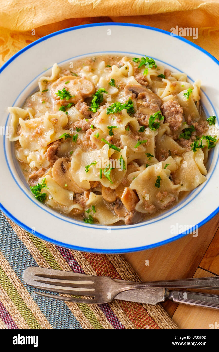 Creamy beef and mushroom stroganoff with egg noodles Stock Photo - Alamy