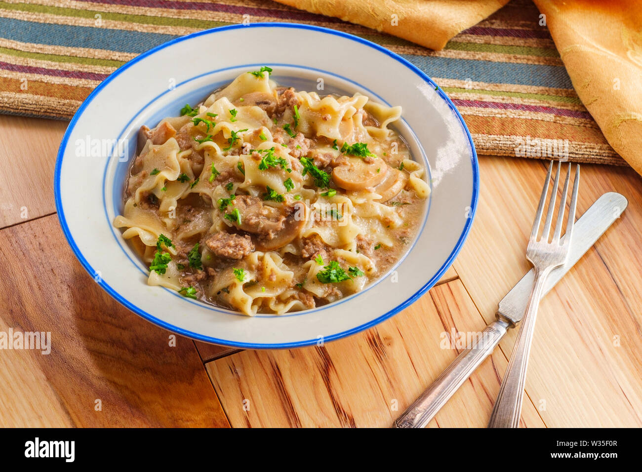 Creamy beef and mushroom stroganoff with egg noodles Stock Photo - Alamy