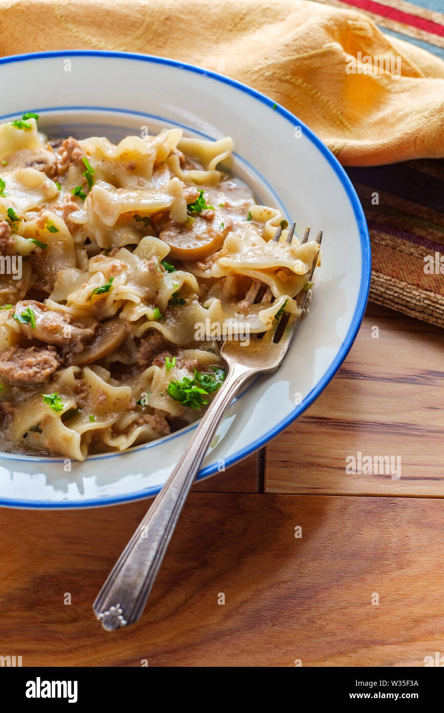 Creamy beef and mushroom stroganoff with egg noodles Stock Photo - Alamy
