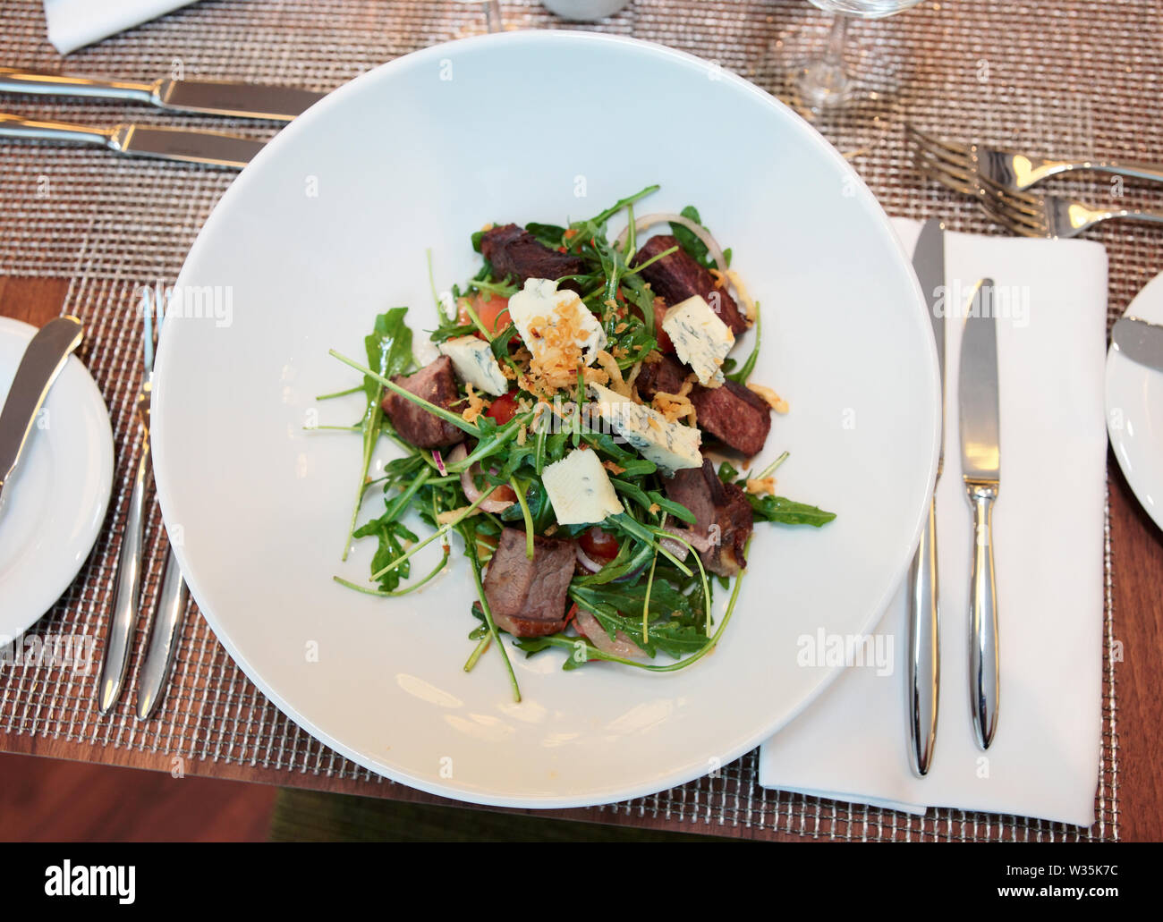 Meat and cheese salad on arranged restaurant table Stock Photo Alamy