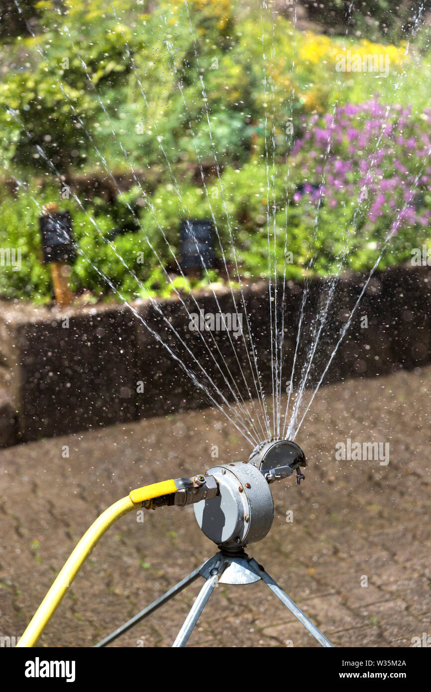 water sprinkler in a garden Stock Photo Alamy