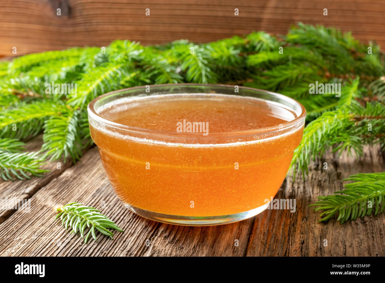 Homemade syrup against cough made from young spruce branches Stock Photo