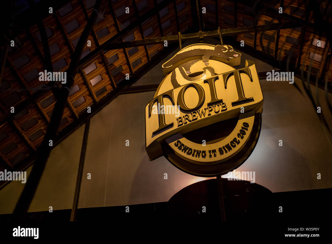 Toits Brewpub's sign outside their venue on a late evening. Stock Photo